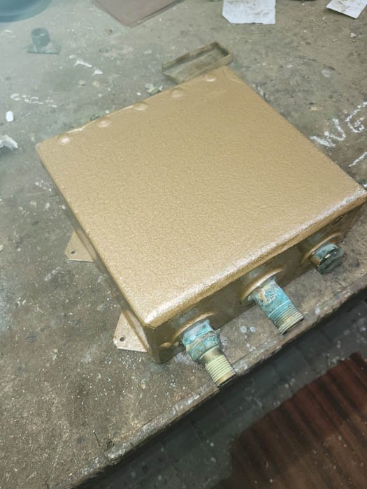 Flush tank painted in copper