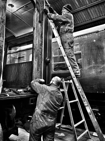 Don and Jim pinning a moulding on the west end