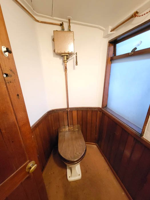 Flush tank mounted  in west toilet