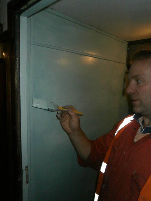 Robbie Thomson painting the second toilet